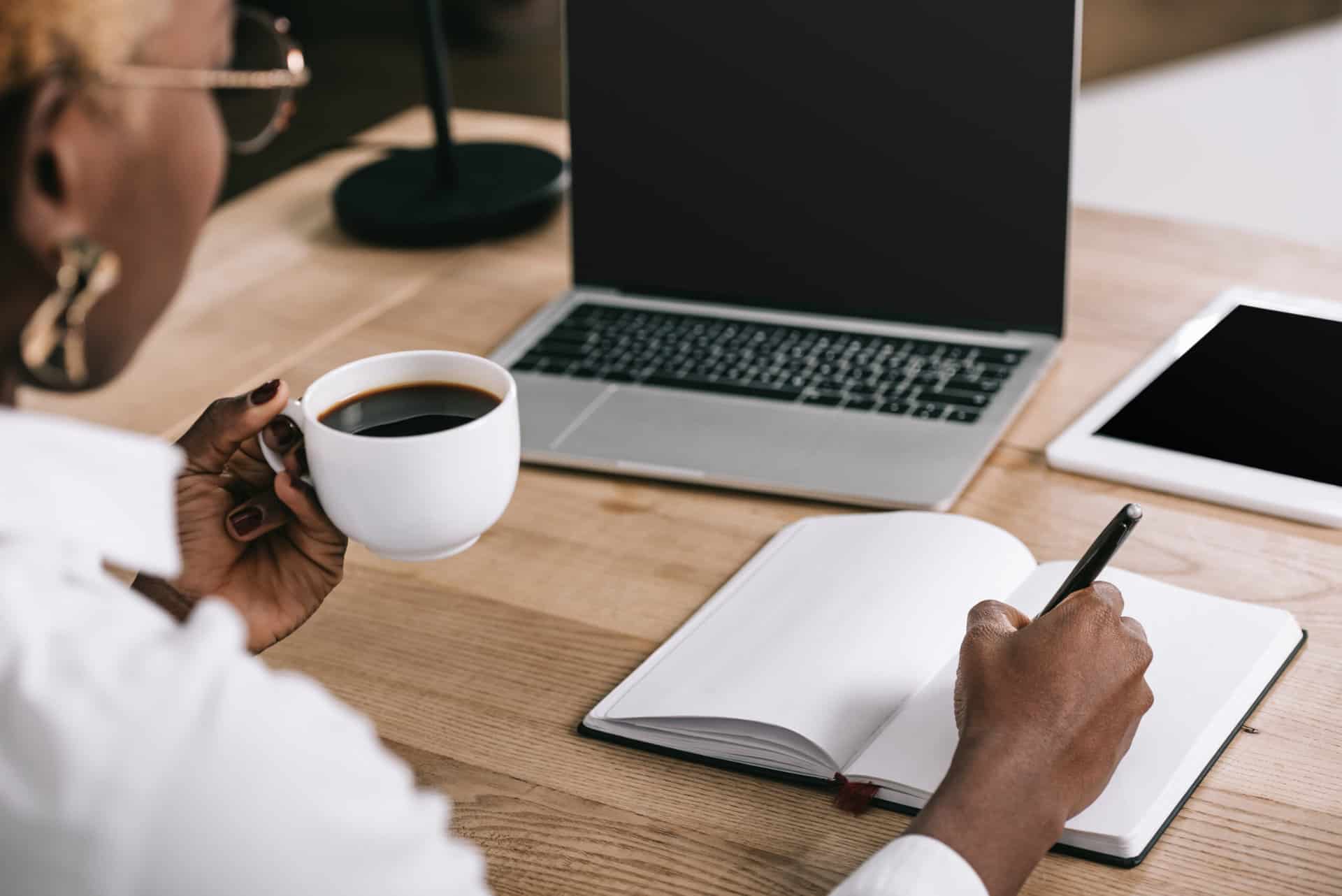 A woman creates an outline for a blog.