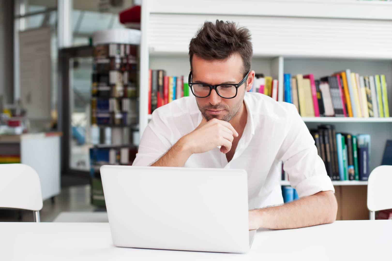 Happy man working on laptop